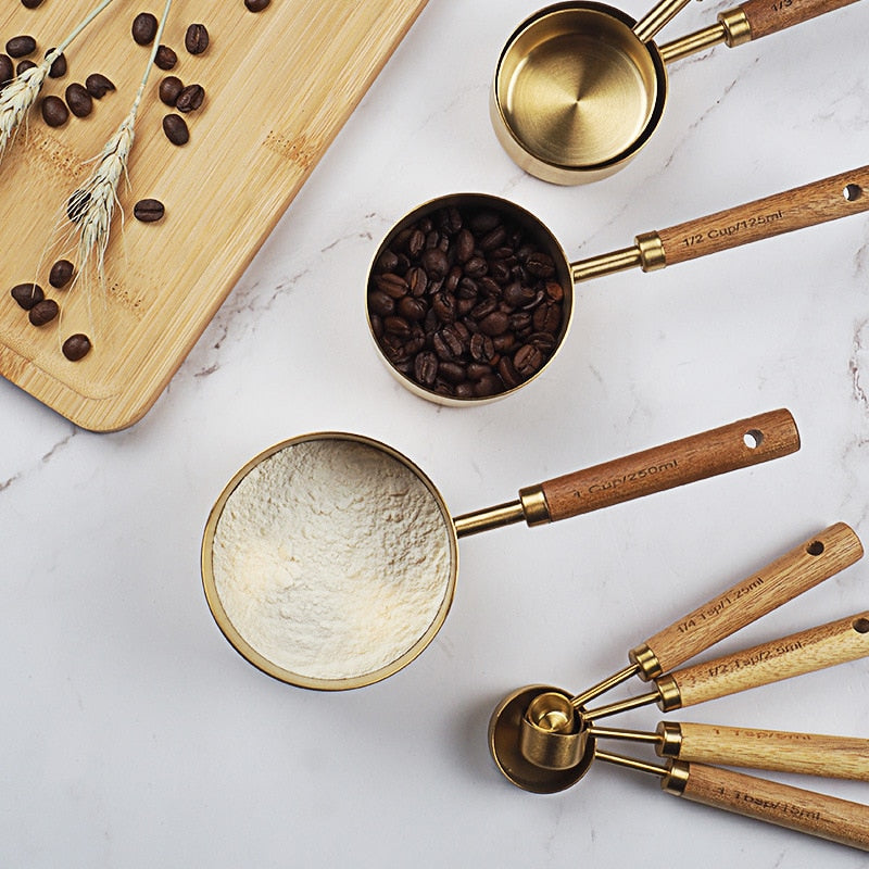 stainless-steel-with-wooden-gold-measuring-cups. jpg