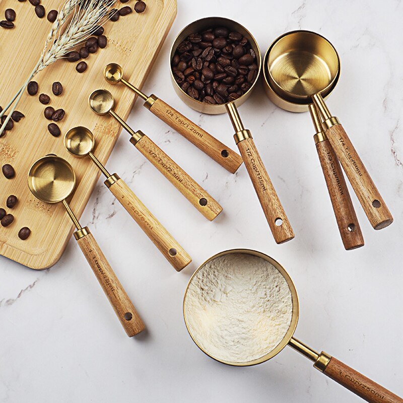 stainless-steel-with-wooden-gold-measuring-cups. jpg