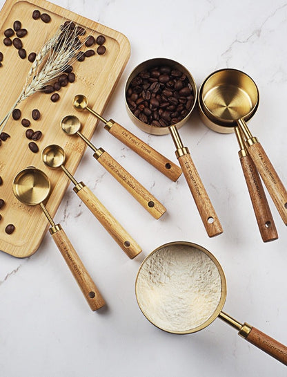 stainless-steel-with-wooden-gold-measuring-cups. jpg